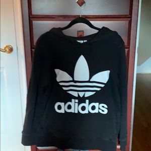 Men’s black adidas hoodie with pockets .
